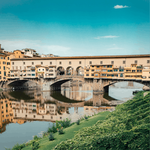 Cross the Ponte Vecchio and begin sightseeing around Florence