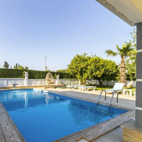 Pour a refreshing drink in the outdoor bar and relax on a lounger by the pool