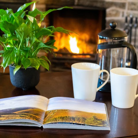 Curl up by the fire with a book for a spot of relaxation 
