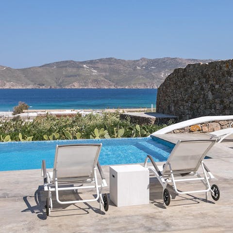 Kick back and admire the views of Panormos Bay