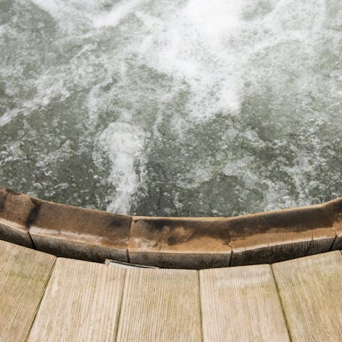Sink into the wooden hot tub