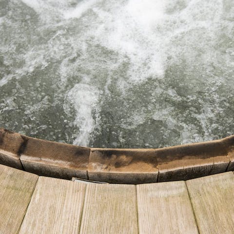 Sink into the wooden hot tub