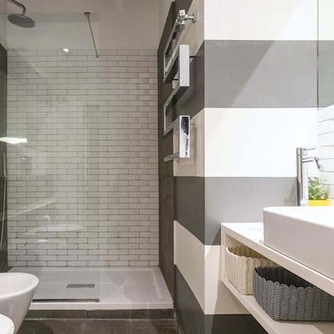 Feel anew beneath the rainfall shower of the pristine bathrooms