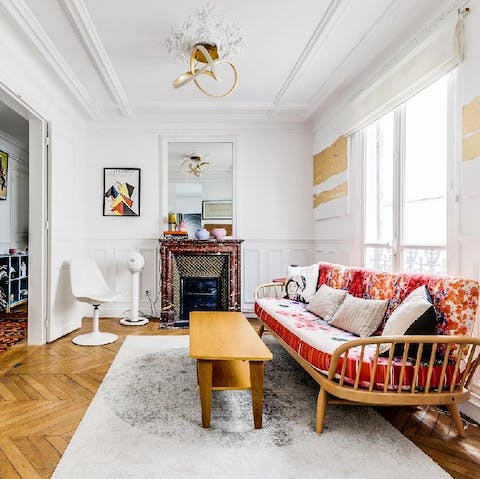Luxuriate in the bright living room with a glass of French wine after a day of sightseeing