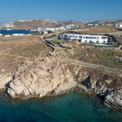 Wind your way down to the private bay to swim in crystal-clear water