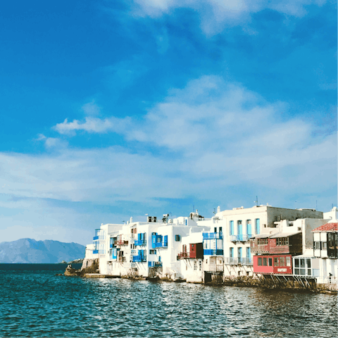 Hit the waterfront bars and winding streets of Mykonos Town, a fifteen-minute drive
