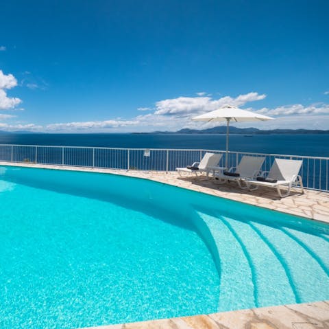 Stretch out on a sun lounger by the shared pool