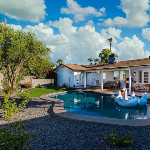 Dip into the pool surrounded by lush greens