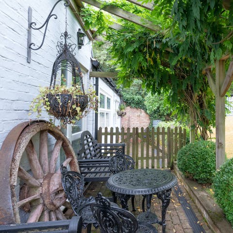 Enjoy a glass of wine in the shared outdoor area as the sun begins to set