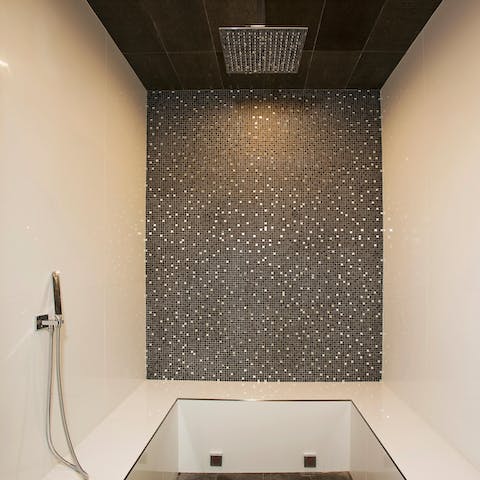 Freshen up in the spa-like bathroom, complete with bubbles (and optional champagne)