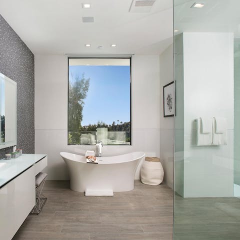 Soak in the freestanding tub with views of the hills and canyons