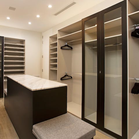 Unpack your suitcases in style in the enourmous walk-in wardrobe