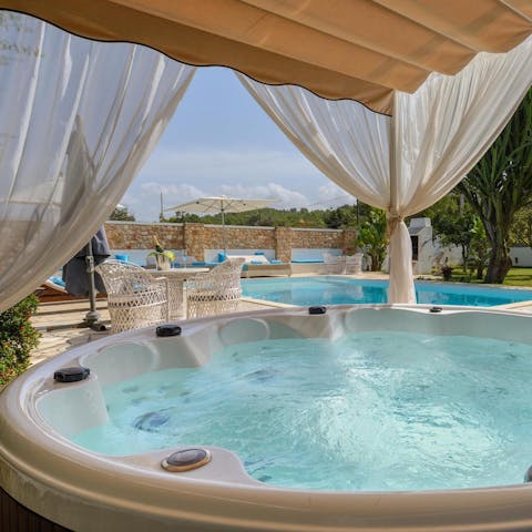 Relax in the hot tub as you sip a glass of wine with loved ones
