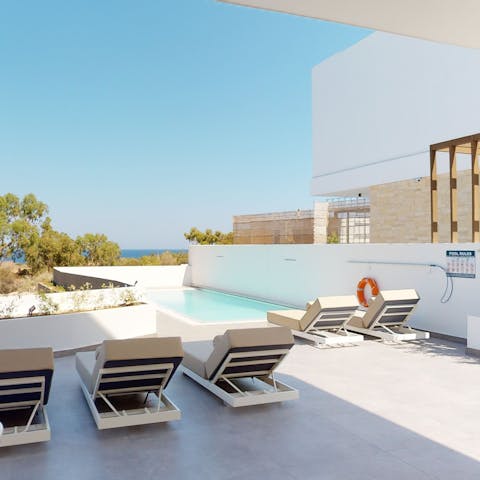 Lounge by the private pool on long, hot afternoons