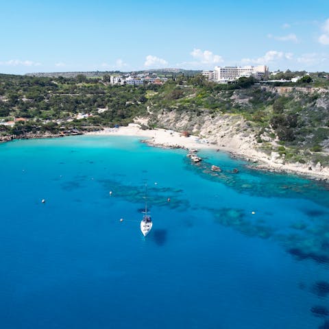 Slip on your flip flops and stroll down to Konnos Beach