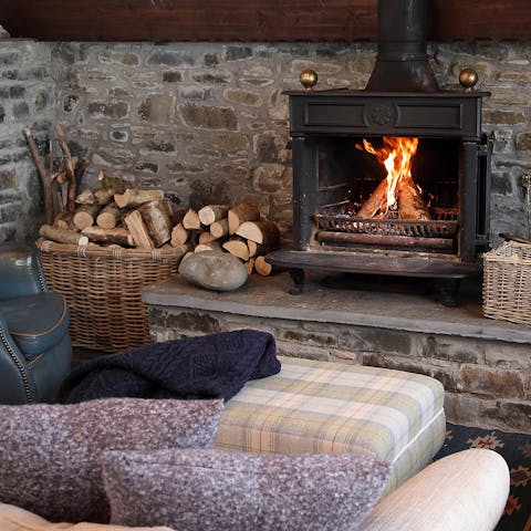 Get cosy by the wood-burning fireplace as the sun sets