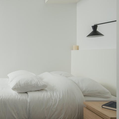 Wake up in the minimalist bedroom feeling rested and ready for another day of Paris sightseeing