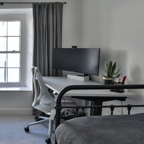 Shoot off a few works emails at the work station in the single bedroom
