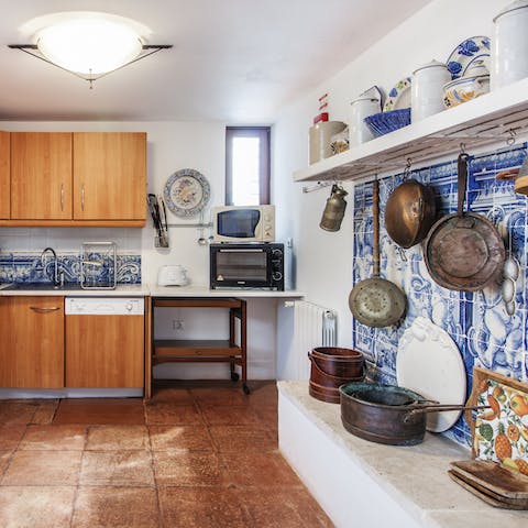 Cook up some traditional Portuguese cuisine in the azulejo-tiled kitchen