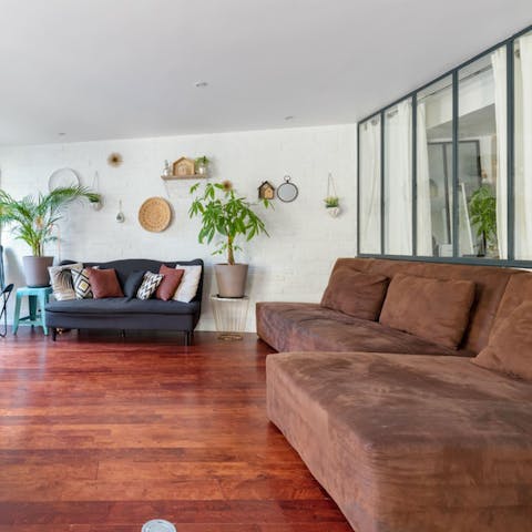 Admire the high-quality furnishings and rich, hardwood floors in the apartment