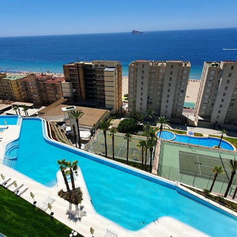 Enjoy a dip in the shared pool, with views of the Mediterranean