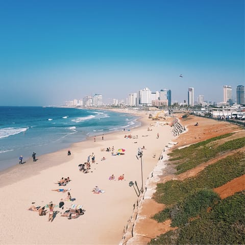Stroll minutes away to spend the day at Aviv Beach