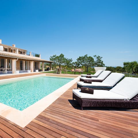 Recline with a magazine by the pool or jump in for a refreshing dip