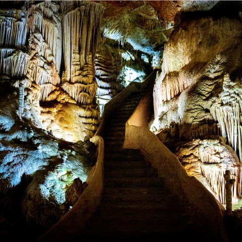 Explore the breathtakingly unique rock formations in the Campanet Caves