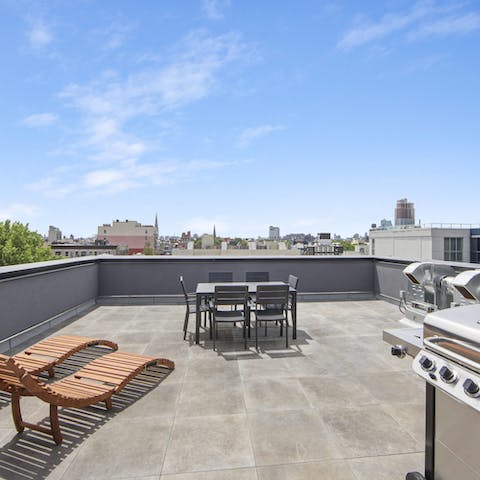 Spend time enjoying your private rooftop terrace with a family barbecue 