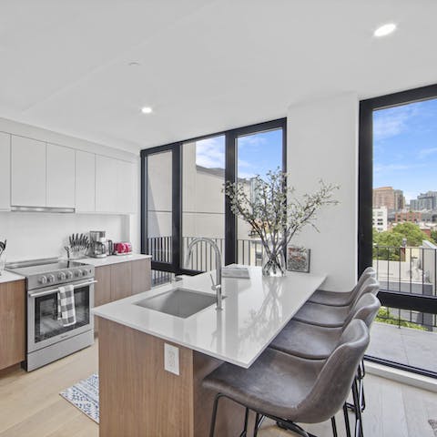 Perch by the sleek breakfast bar for a coffee before setting off