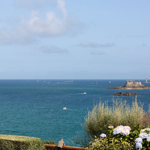 Stroll along Dinard's promenade and stop off at beaches and cafes along the way