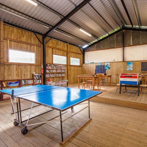 Play a ping pong or foosball tournament in the shared games room