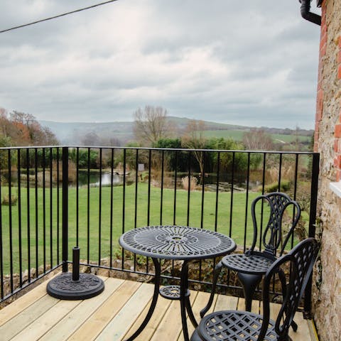 Sip your morning coffee on the balcony overlooking the sprawling fields