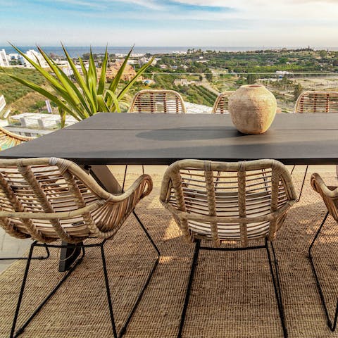 Take in the sea views from the alfresco dining table