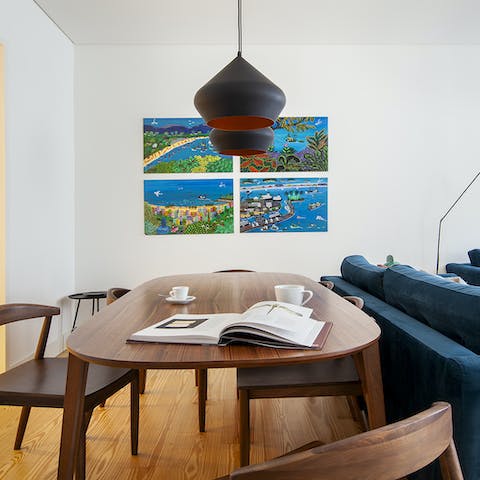 Lift your spirits with the bold and vibrant artwork in the open living/dining space