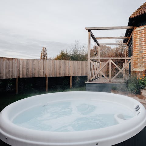 Unwind in the hot tub after a day in the hills