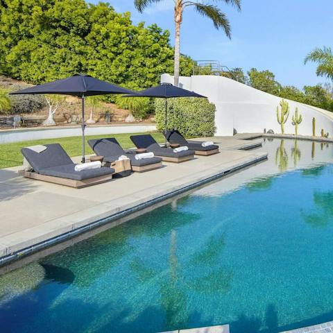 Spend relaxing days by the swimming pool or make the short drive to the beach