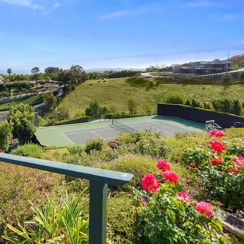 Make your way down through the gardens and onto the tennis court
