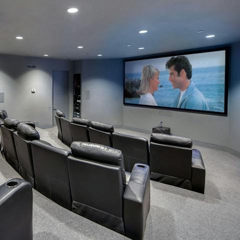 Enjoy an atmospheric night at the movies from the cinema room