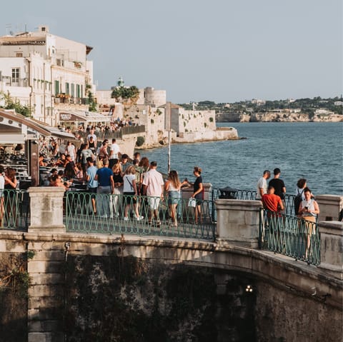 Dine along Ortigia's vibrant marina, a short walk away