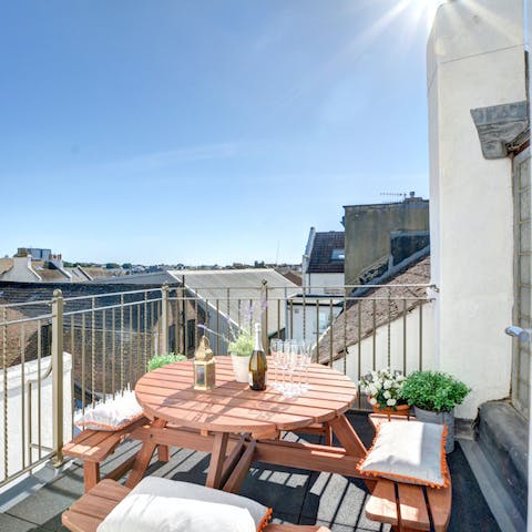 Enjoy drinks on the balcony, with views of the sea