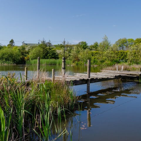 Cast your rod at the coarse fishing lake with a decking area