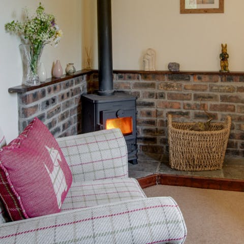 Snuggle up next to the wood burner after a day adventuring