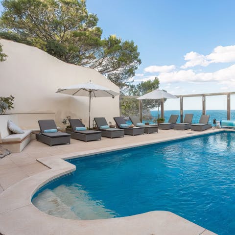 Relax by the outdoor private pool and top up your tan on a sun lounger