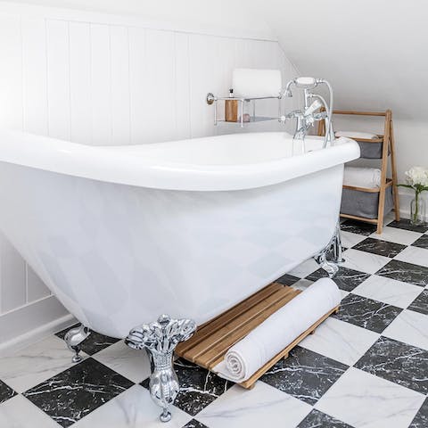Treat yourself to an uninterrupted soak in the shining claw-foot bathtub