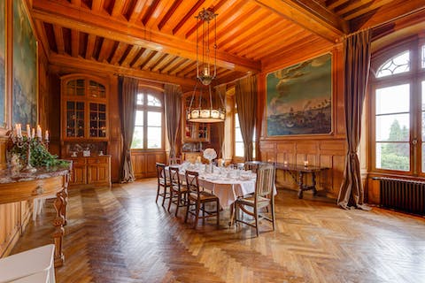 The elegant wood-panelled dining room 