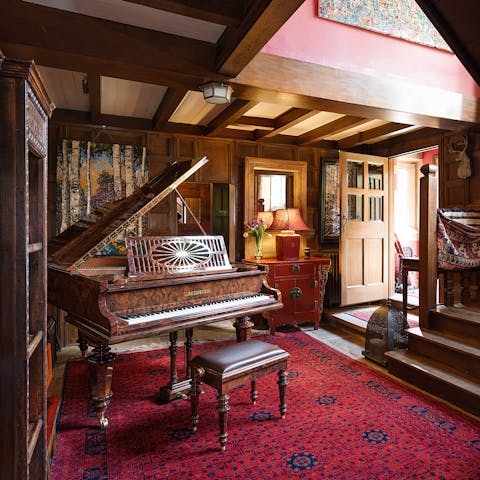 Fill the manor with music with a few tunes on the piano