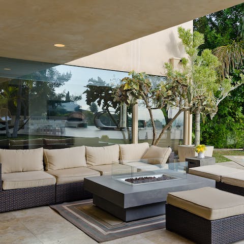 Chill out around the fire table on the covered terrace