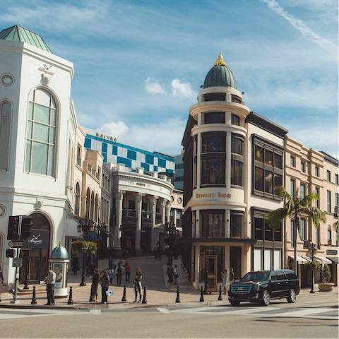 Visit the high-end fashion boutiques on nearby Rodeo Drive