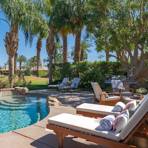 Soak in the sun before cooling off in the pool
